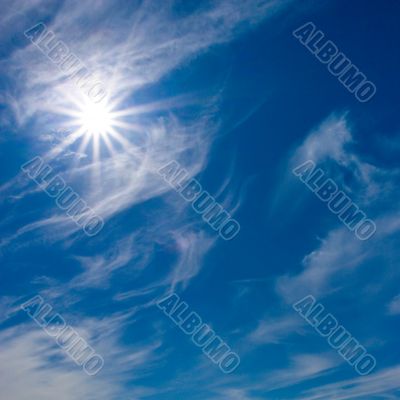 Rays of sun on blue sky