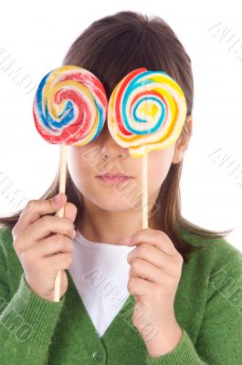 Girl eating two lollipops Girl eating two lollipops