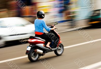 Riding a scooter Riding a scooter