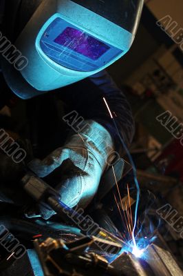 Welder wearing a protection mask