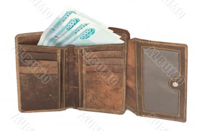 brown leather wallet with some bank notes