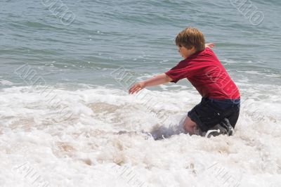 Boy Playing in the Ocean
