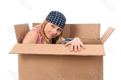 Girl hiding in a cardboard box