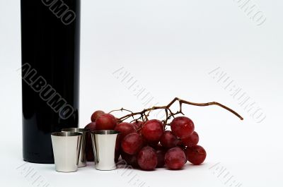 Cups, grapes, vine still life