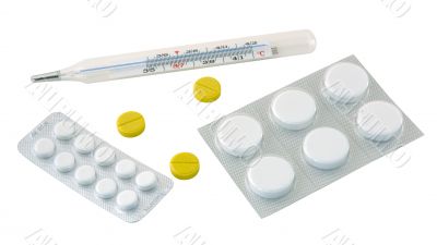 Thermometer and pills. Thermometer and pills.