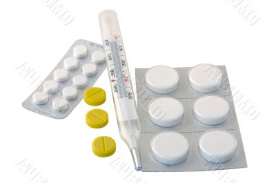 Thermometer and pills. Thermometer and pills.