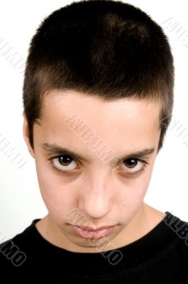 teenage boy with big brown eyes looking sad