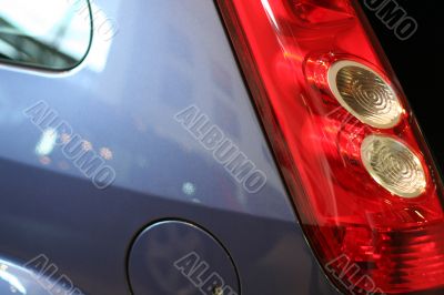 detail of new car in dealership showroom