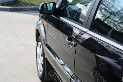 detail of new car in dealership showroom