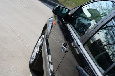 detail of new car in dealership showroom