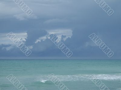 dark blue sky over turquoise ocean