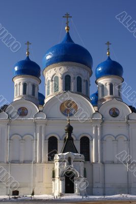 Big white-blue church up against blue sky