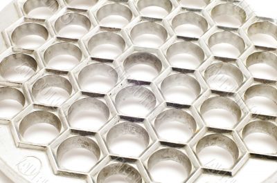 form for ravioli on white