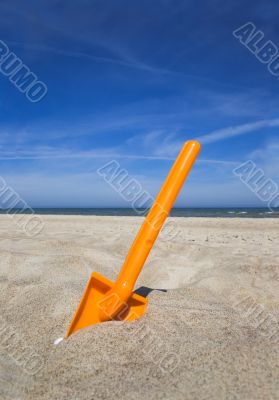 Orange plastic beache spade