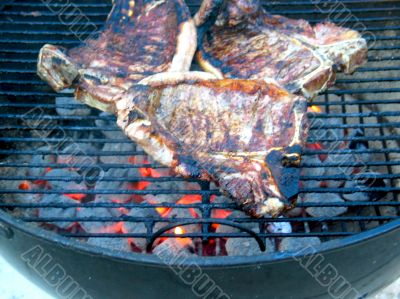 Grilled T-Bone Steaks Still Cooking