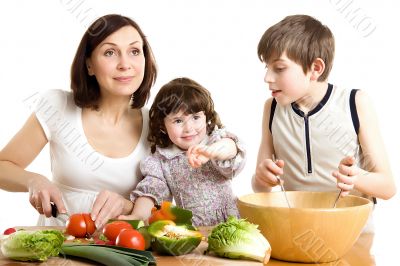 mother and children cooking at the kitchen