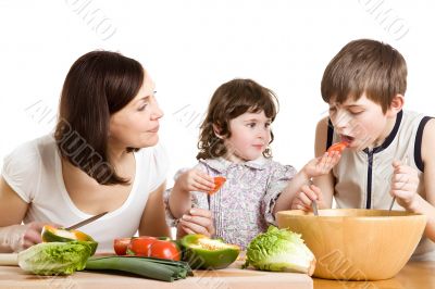 mother and children cooking at the kitchen