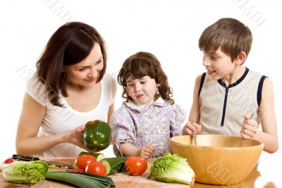 mother and children cooking at the kitchen