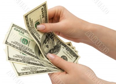 US Dollars in woman`s hand, isolated with clipping path
