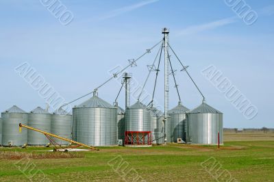 Grain silos on a farm in spring Grain silos on a farm in spring