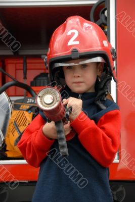boy is sitting in a fire truck