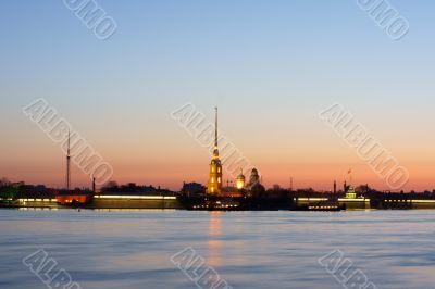 The Peter and Paul Fortress in beams of a dawn