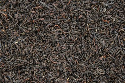 Black tea leaves background