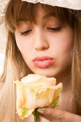 blonde woman with tea rose