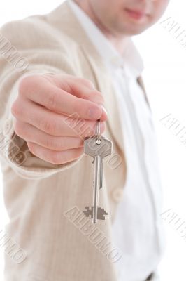 Businessman holding the keys of new house