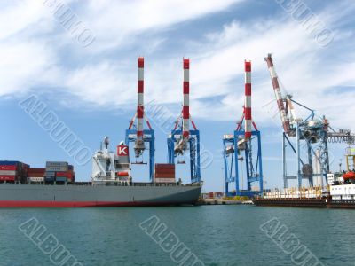 container ship in a dock with  crane