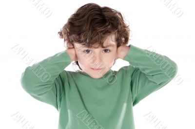 Child holding his hands against his ears Child holding his hands against his ears
