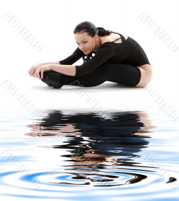 fitness in black leotard on white sand #2