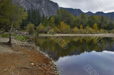 Mountains are reflected in water of lake