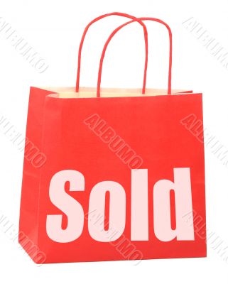 bag with white sold sign