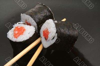 close-up of sushi and chopsticks