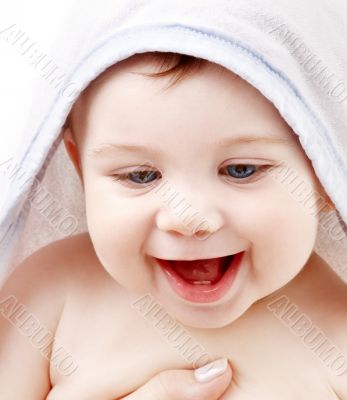 happy baby with terry hoodie robe on head