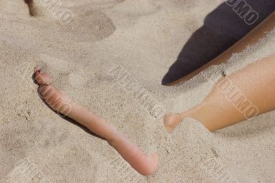 Leg in sand