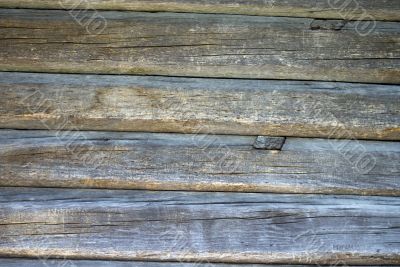 A piece of rough wooden uncolored shed wall