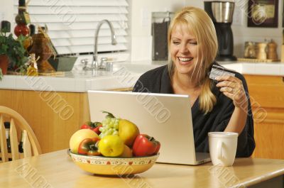 Woman Using Laptop for E-commerce