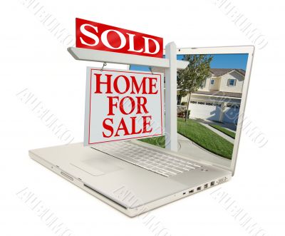 Sold Home for Sale Sign &amp; New Home on Laptop