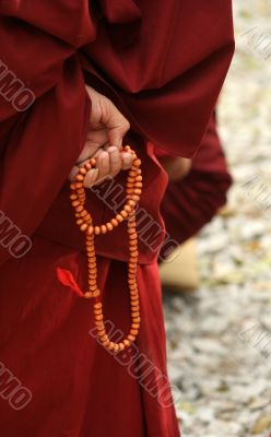 Monk`s hand with bead