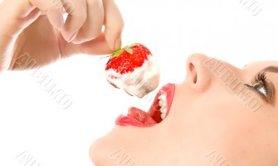 beautiful girl eating a strawberry