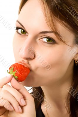 beautiful girl eating a strawberry