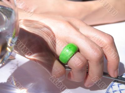 green ring on a hand