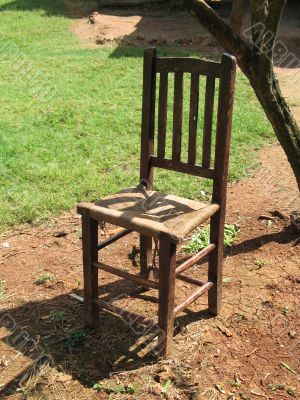 old chair on dirt ground