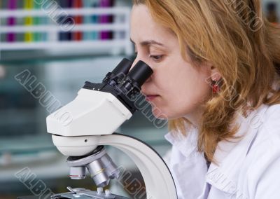 Looking through a microscope