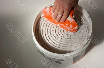 bucket of tile adhesive