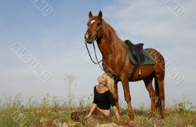 teen and horse in field