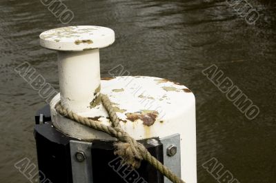 Iron bollard with ship ropes