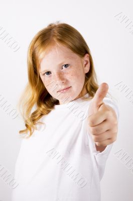 cute little girl with thumb up (focus on face )